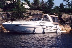 32 Rinker tied to the rocks up at the BlackBay in Georgian Bay